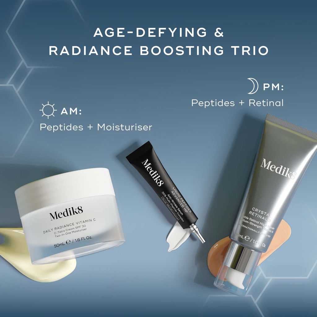Three Medik8 skincare products, including a white jar, a silver pump bottle, and a white tube, arranged on a light blue, rippled fabric background. A white circular burst with the text 'SAVING £33' is prominently displayed in the top left corner.
