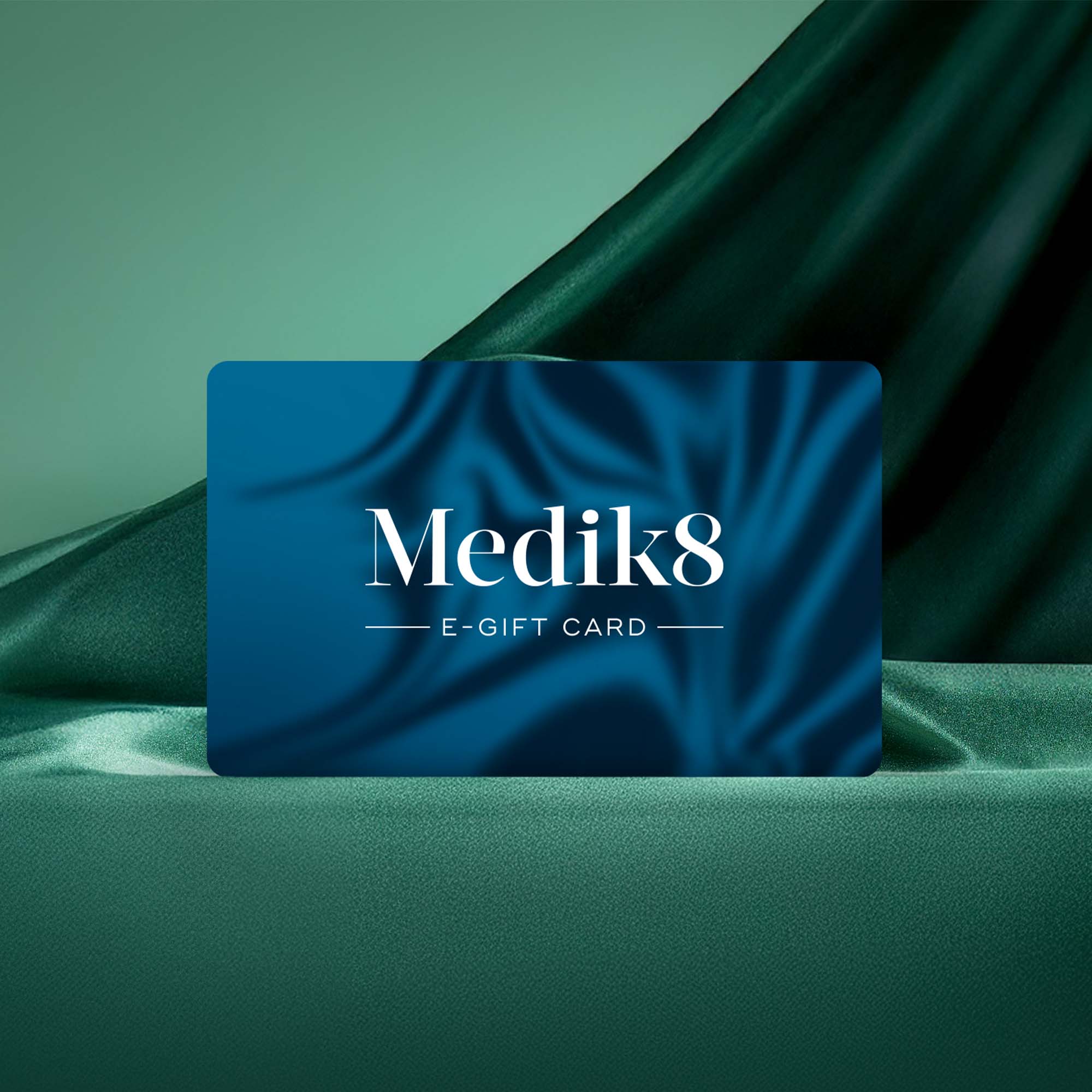 Blue Festive placeholder image of Medik8 e-gift card on green fabric