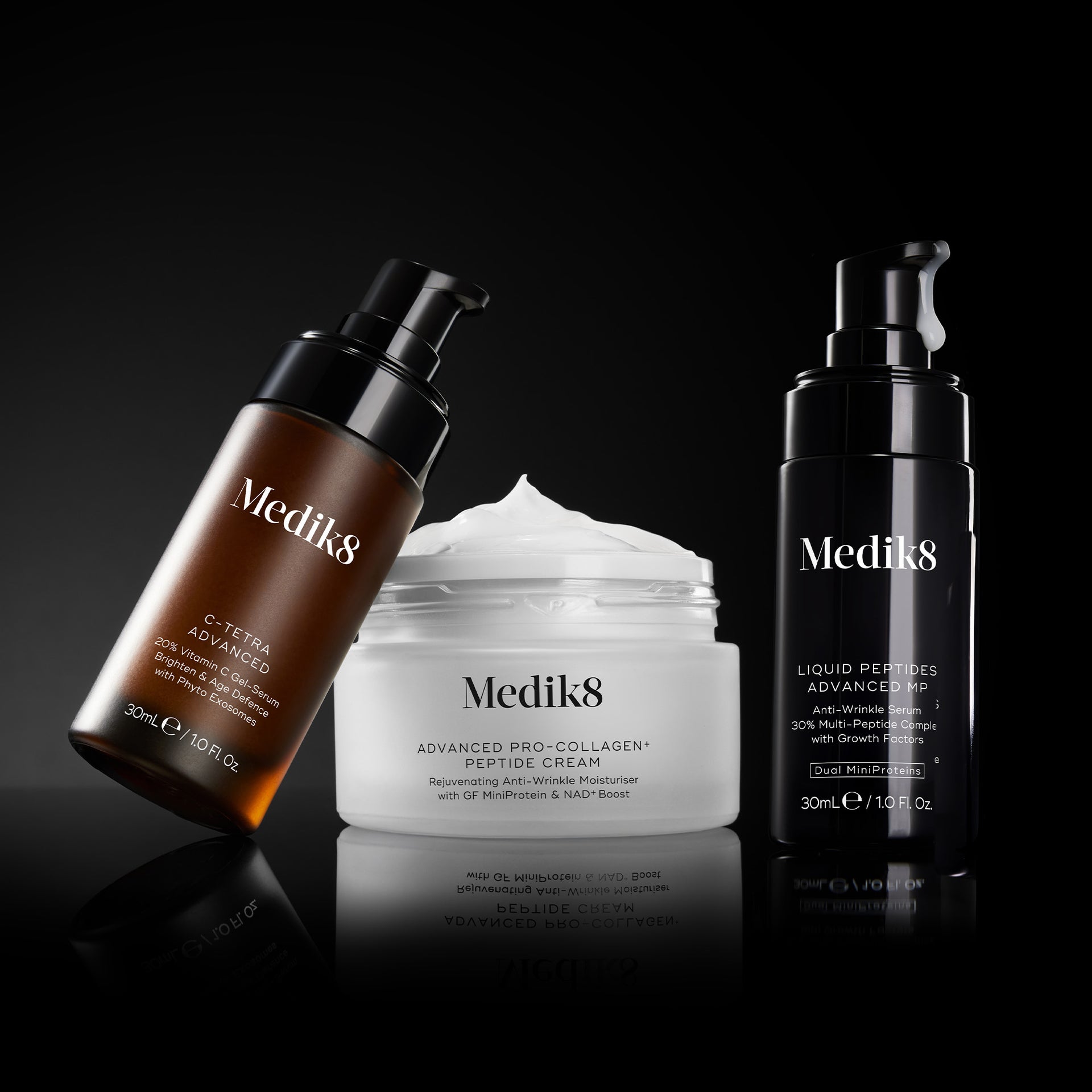 3 products on black backgrounf leaning on eachother. The products are C-Tetra Advanced, Advanced Pro-Collagen Peptide Cream and Liquid Peptides Advanced MP