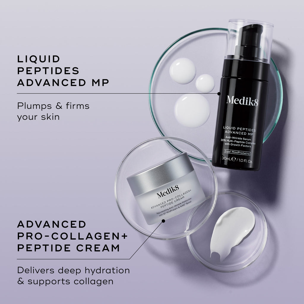 An overhead shot of the Peptide Boosters duo—Liquid Peptides Advanced MP and Advanced Pro-Collagen+ Peptide Cream—arranged with petri dishes showing white serum droplets and a smear of white cream against a lilac background. Text links each product to its benefit: "Plumps & firms your skin" and "Delivers deep hydration & supports collagen."