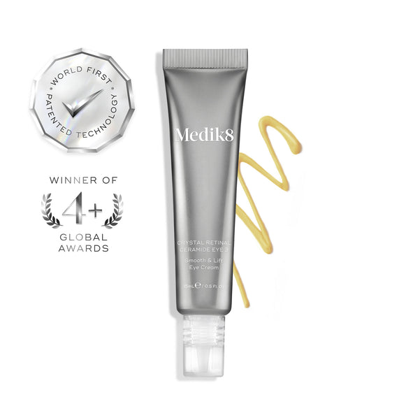 Medik8 Crystal Retinal Ceramide Eye 3 cream tube next to a zigzag swatch of yellow cream on a white background. Two silver badges highlight "WINNER OF 4+ GLOBAL AWARDS" and "WORLD FIRST PATENTED TECHNOLOGY".-1