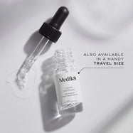 A small clear glass bottle (8mL) of Medik8 Liquid Peptides serum, with its dropper resting beside it. Text indicates it's "ALSO AVAILABLE IN A HANDY TRAVEL SIZE.
