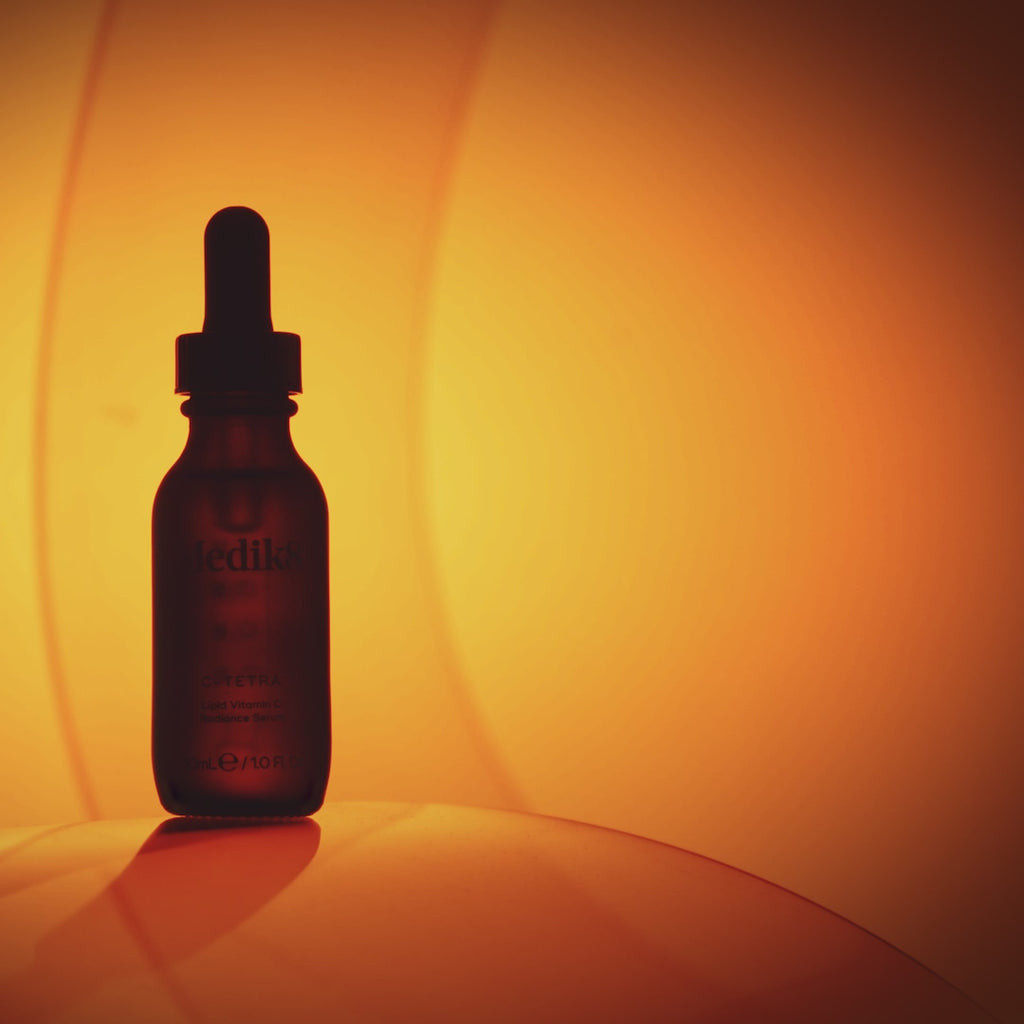 A video featuring the Medik8 C-Tetra serum bottle and a woman with glowing skin. Text overlays highlight key benefits: "Restores visible skin radiance in just 7 days," contains 7% Vitamin C, and is ideal for sensitive, congestion-prone skin, or those new to Vitamin C.